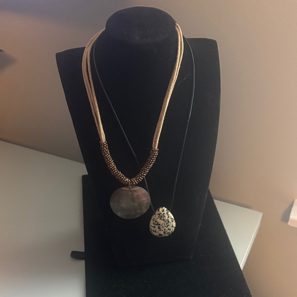 2 BOHO necklaces with pendants in cream and bronze with cloth strands.